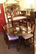 Strongbow mahogany extending pedestal dining table and six Hepplewhite style chairs including pair
