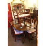 Strongbow mahogany extending pedestal dining table and six Hepplewhite style chairs including pair