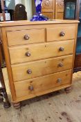 Pine chest of two short above three long drawers on turned legs,