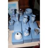 Collection of boxed blue Jasperware including vases, candlesticks, tea lights, etc.