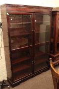 Mahogany glazed four door bookcase, 183cm high by 130cm wide by 33cm deep,