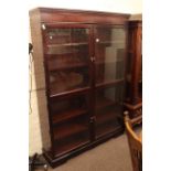 Mahogany glazed four door bookcase, 183cm high by 130cm wide by 33cm deep,