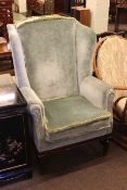 Georgian style wing back armchair in green draylon.