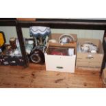 Four boxes of assorted china, glass, oak mantel clock, figure table lamp, cutlery, etc.