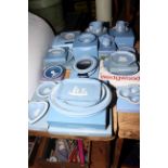 Collection of Wedgwood Blue Jasperware including cups and saucers, photograph frames, trays,