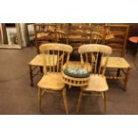 Three rush seated Country ladder back chairs including one rocker,