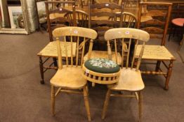 Three rush seated Country ladder back chairs including one rocker,