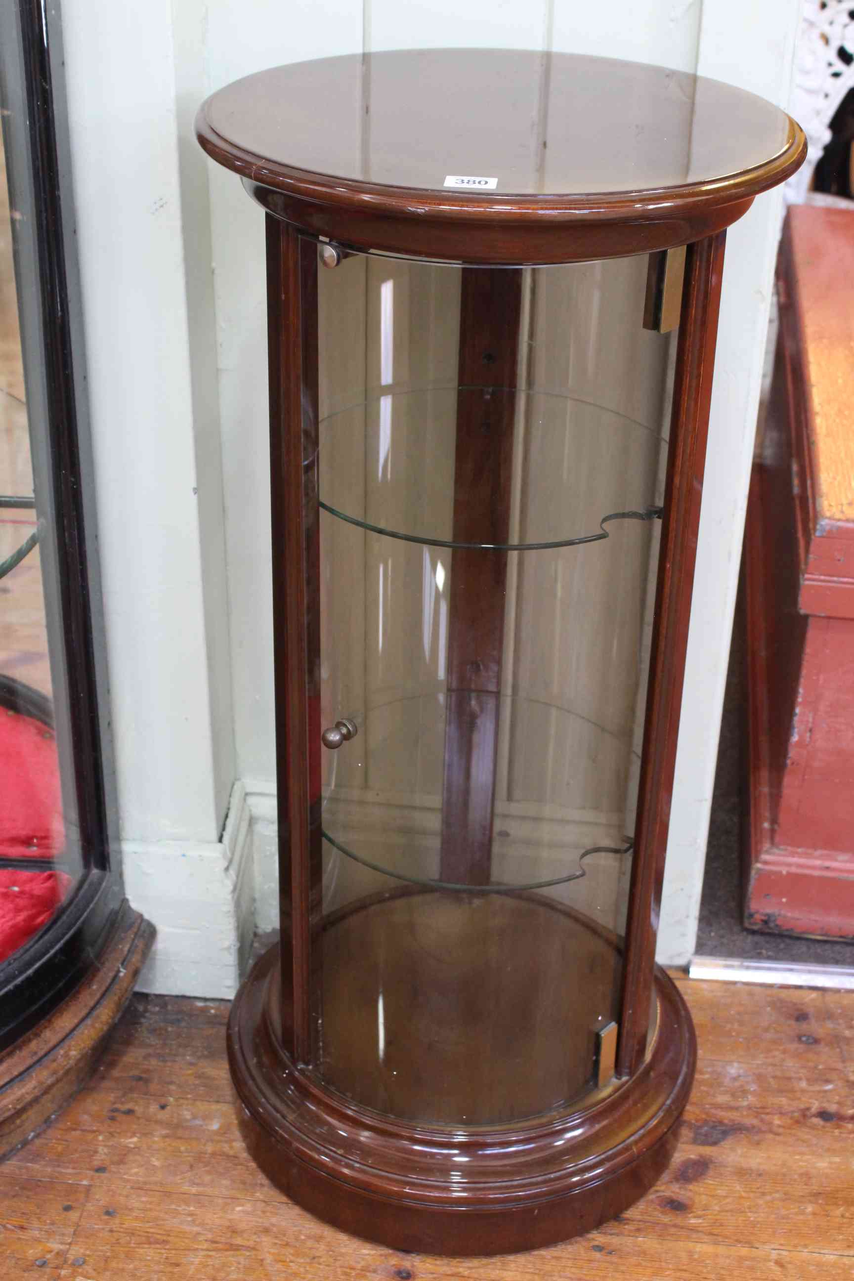 Cylinder display cabinet, 88cm high by 32cm diameter.