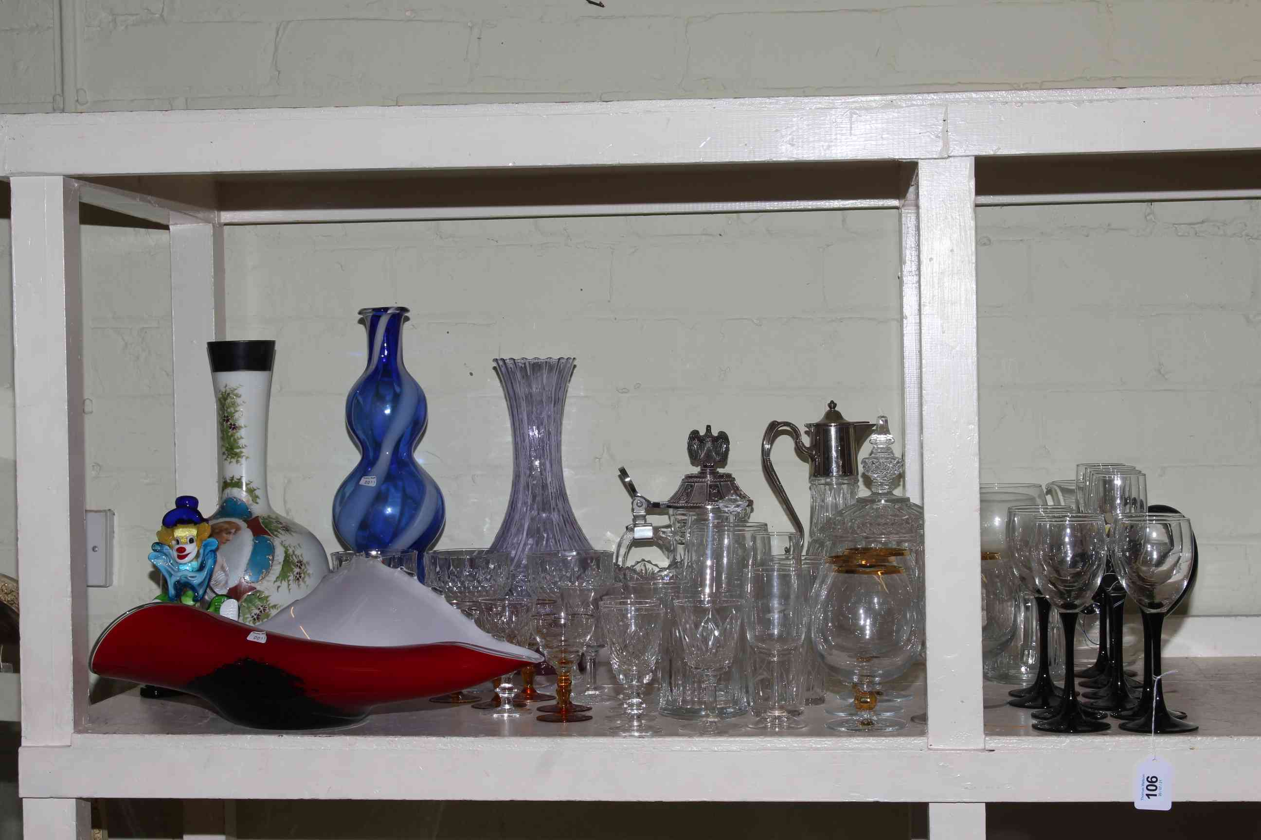 Collection of glassware including Victorian painted vase, glass clown, ewer, tankard, vases, etc.