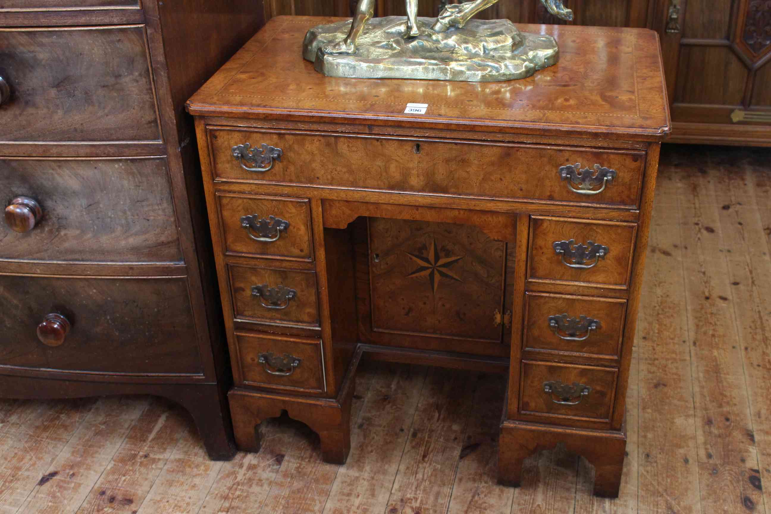 Georgian style burr walnut and chequer inlaid seven drawer kneehole desk with inset central