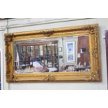 Large rectangular gilt framed bevelled wall mirror, 182cm by 96.5cm overall.