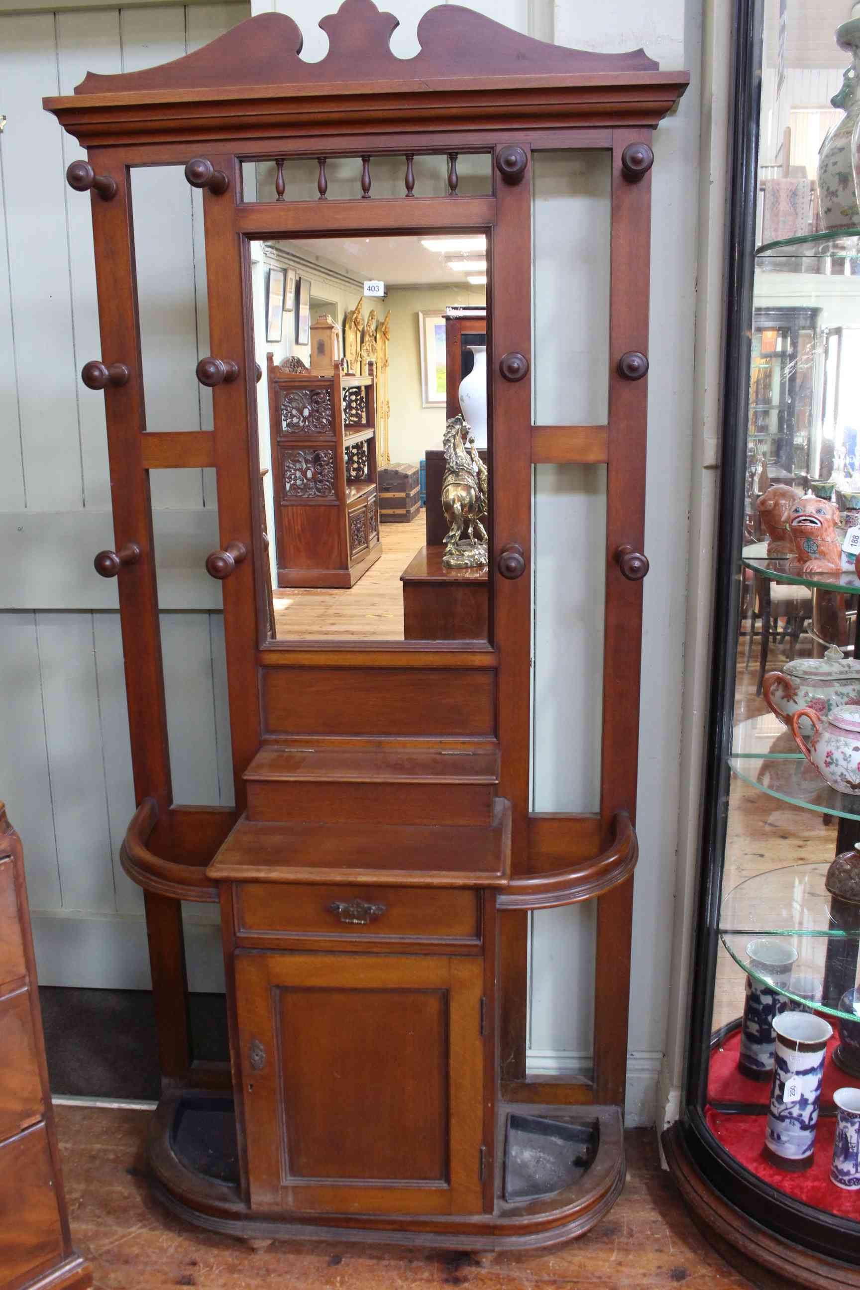 Early 20th Century oak mirror back hallstand, 207cm high by 102cm wide by 36cm deep.