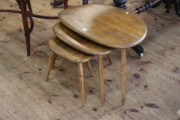 Vintage Ercol pebble nest of three tables (largest 40cm high by 65cm wide by 44cm deep).