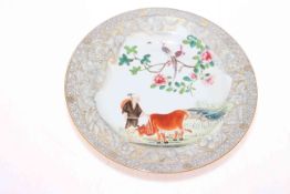 Antique Chinese porcelain plate decorated with cow and farmer, 23cm diameter.