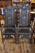 Pair high carved panel back open armchairs.