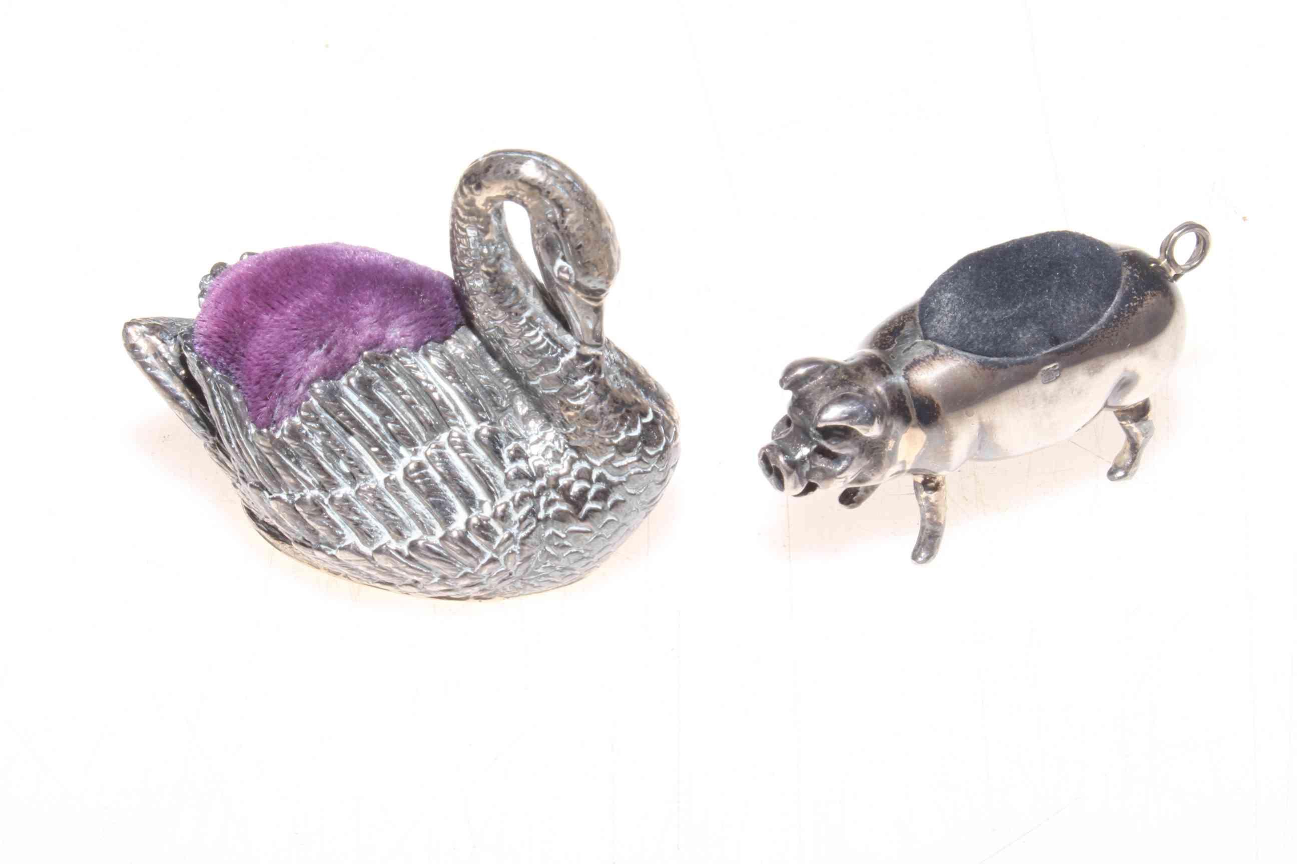 Silver pig pin cushion stamped 925, 5cm long, and swan pin cushion (2).