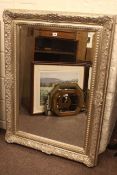 Two tone silvered framed bevelled wall mirror, 115cm by 85cm overall.