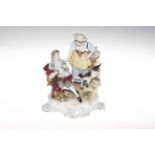 Continental porcelain pastoral group of piper and maiden, 26cm.