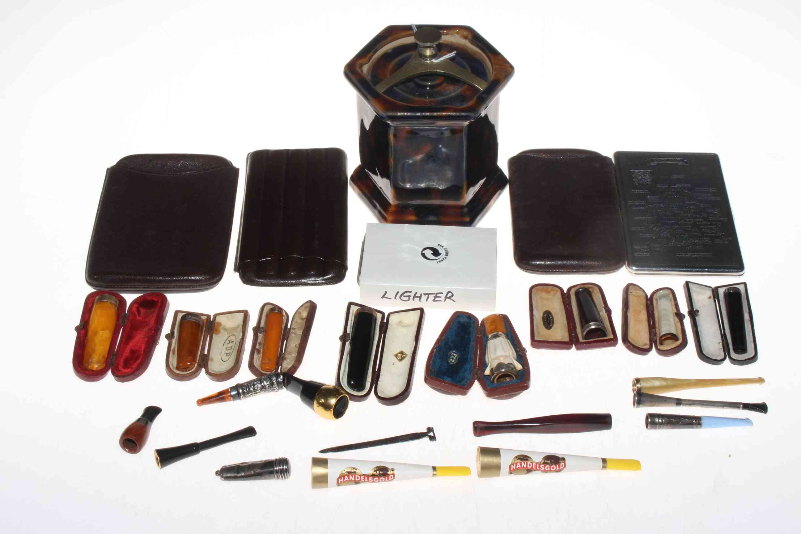 Box of smoking related collectables including eight cased cheroot holders (some gold and silver