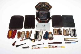 Box of smoking related collectables including eight cased cheroot holders (some gold and silver