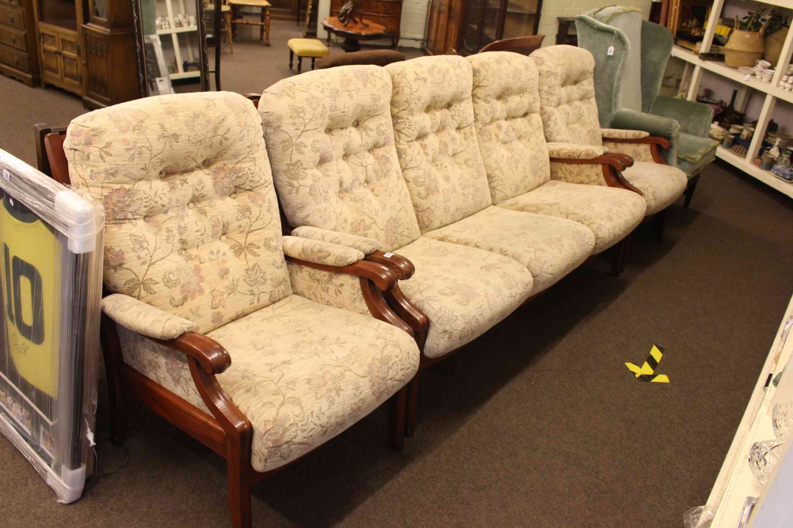 Parker Knoll three piece lounge suite in light buttoned floral fabric.