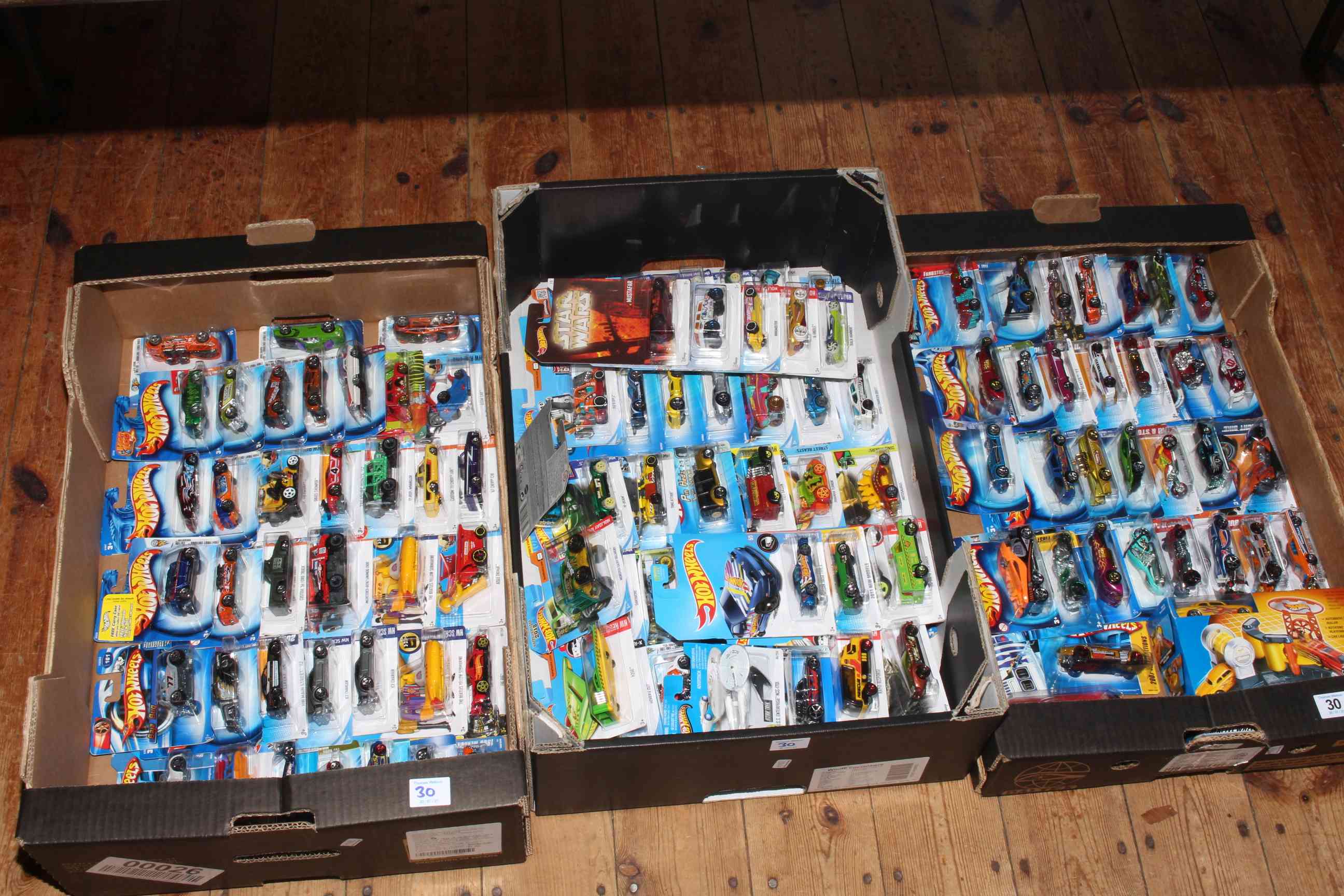 Collection of over 100 Hot Wheels model vehicles, as new.