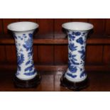Pair Chinese blue and white vases decorated with foliage, 32cm, with stands.