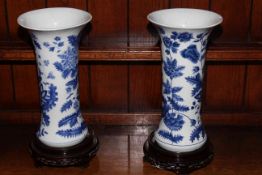 Pair Chinese blue and white vases decorated with foliage, 32cm, with stands.