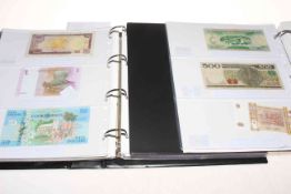 Two albums of Worldwide A to Z banknotes including uncirculated, high revenues, Middle East,