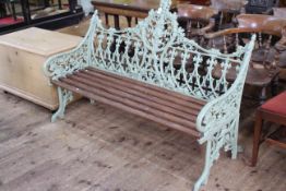 Coalbrookedale style cast garden bench with circular panelled shield back, 100cm high by 149cm long.