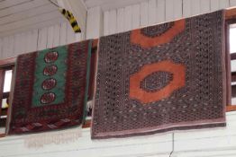 Two Bokhara style rugs 2.00 by 1.25 and 1.60 by 0.95.