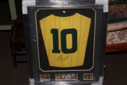 Framed Brazil football shirt with signature for 'Pele'.