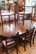 Oval mahogany twin pedestal extending dining table and two leaves,