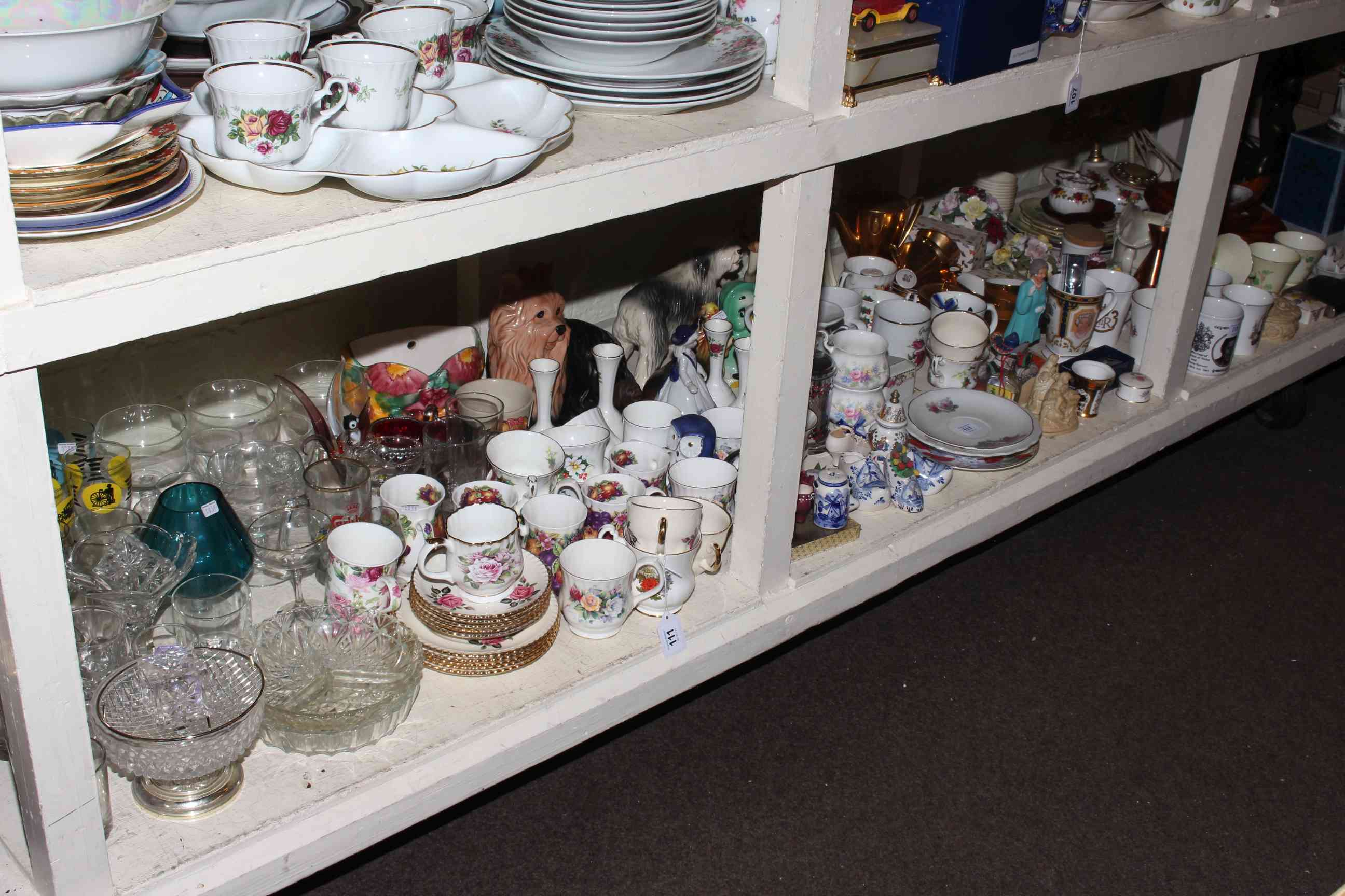 Assorted teaware, commemorative cups, ornamental dogs, glassware,
