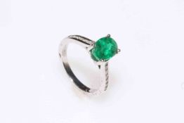 Emerald and diamond ring set in 18 carat white gold having 1.70 carat oval emerald, size K.