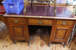 Late Victorian pedestal desk having three drawers above two cupboard doors,