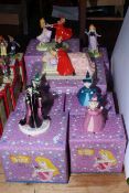 Disney Showcase Collection including Loves First Kiss, and Sleeping Beauty, seven pieces with boxes.