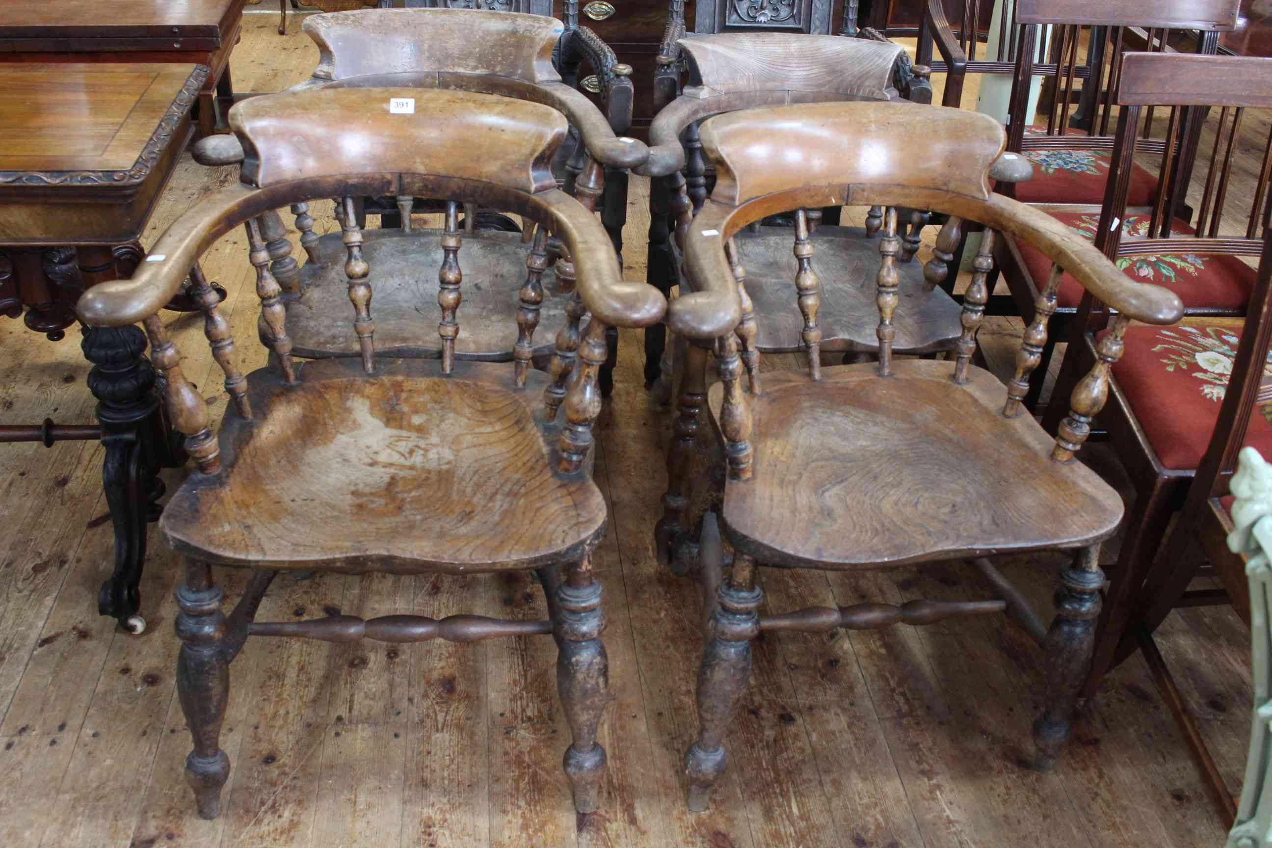 Four similar Victorian Captains chairs.