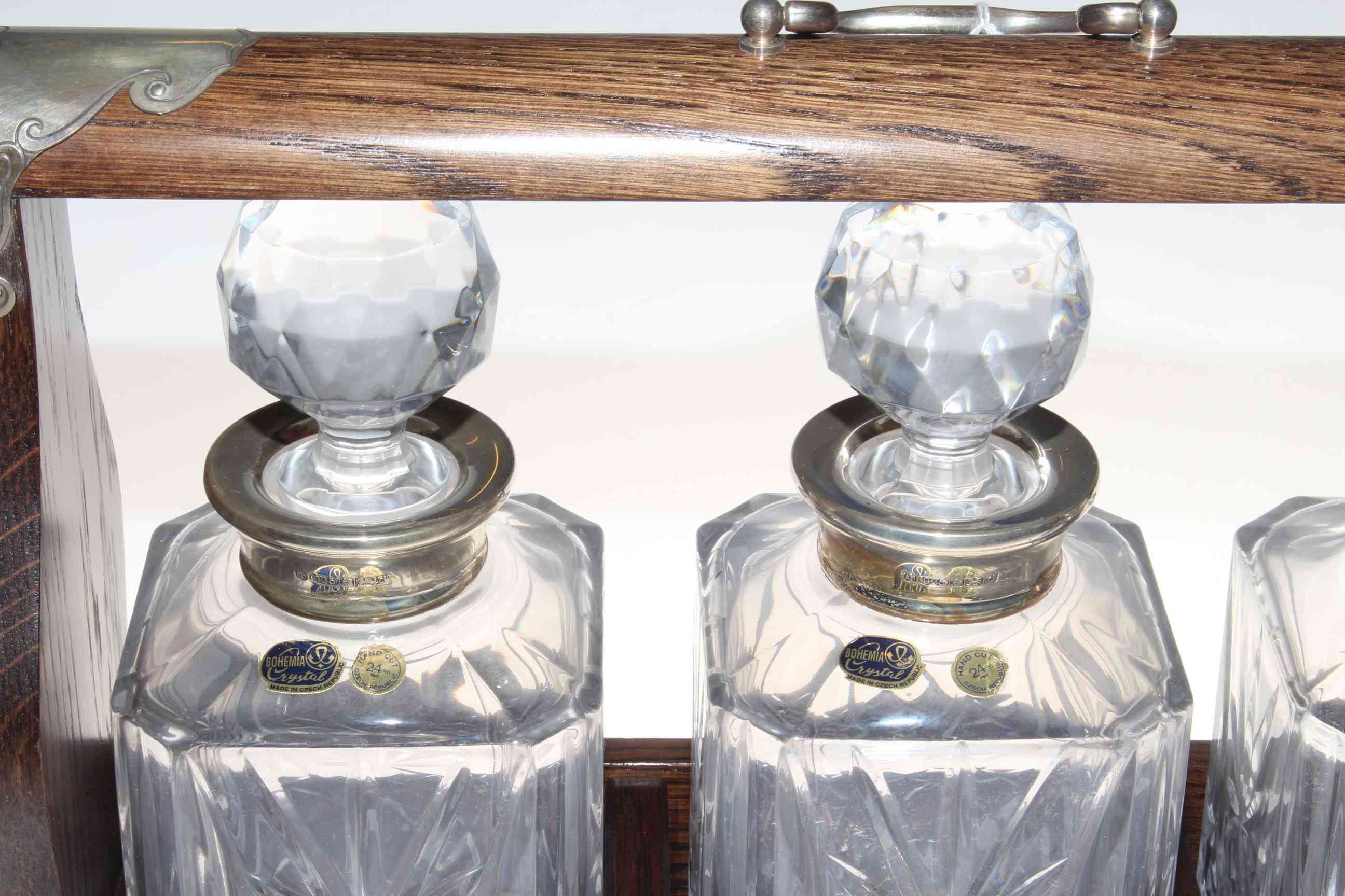 Oak and silver mounted tantalus with three silver collared Bohemia Crystal decanters, 40cm by 30cm. - Image 2 of 2