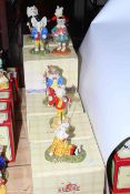 Royal Doulton Rupert figures, seven pieces, with boxes.