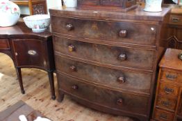 Victorian mahogany bow front chest of four long drawers on splayed legs,