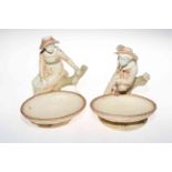 Pair Royal Worcester Hadley figure tazza, boy and girl with basket resting,