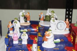 Coalport Characters The Snowman groups, and figures and annual plaque, seven pieces with boxes.