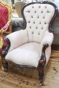 Victorian style mahogany framed button back armchair.