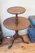 Mahogany two tier graduated circular dumb waiter on pedestal tripod base, 81cm high.