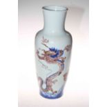 Chinese blue dragon vase decorated with two dragons and fish emerging from the sea,