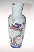 Chinese blue dragon vase decorated with two dragons and fish emerging from the sea,