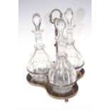 Silver plated decanter stand with three glass decanter bottles, 40cm high.