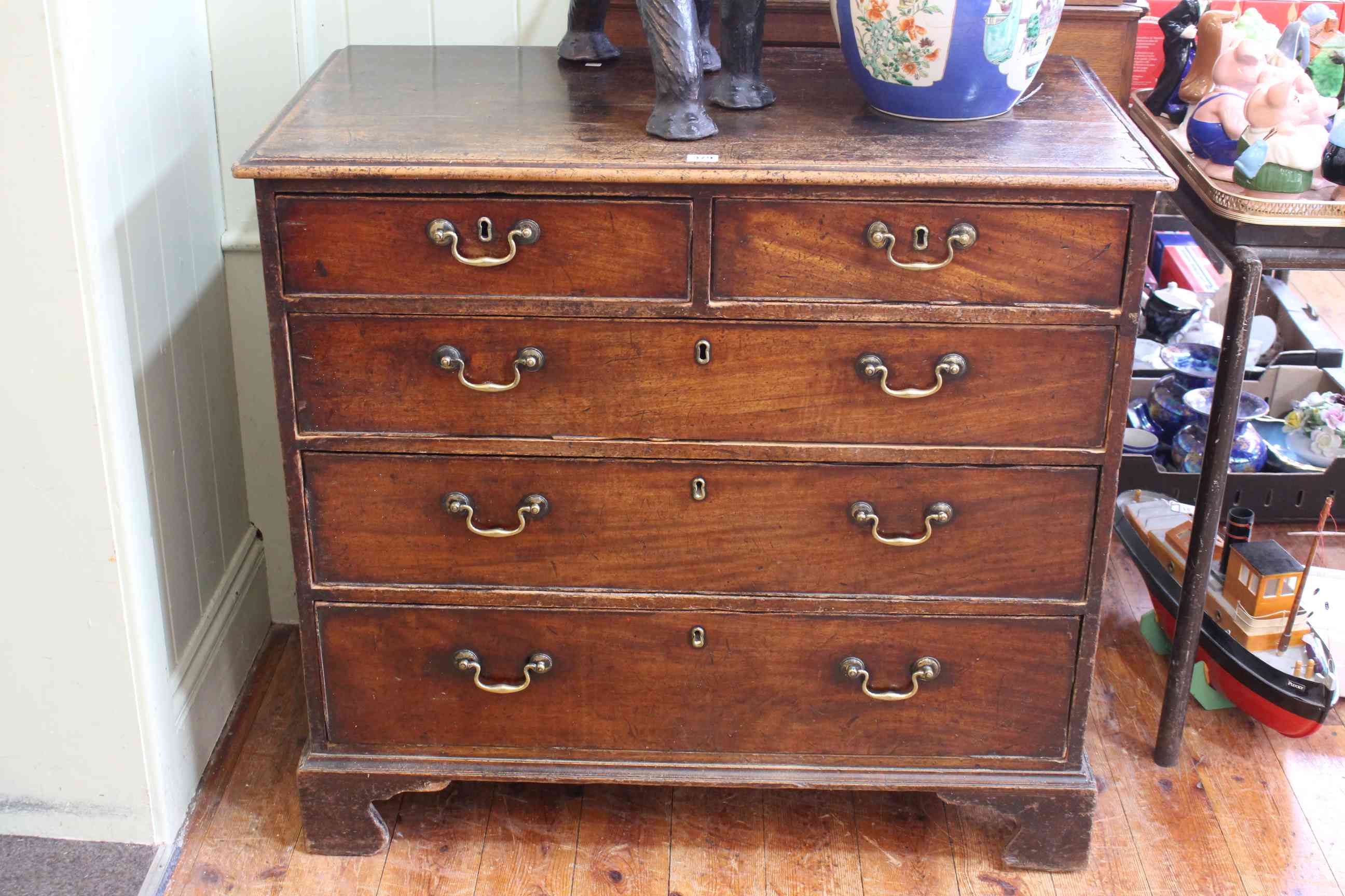 Georgian mahogany chest of two short above three long drawers on bracket feet,