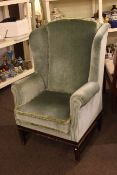 Georgian style wing back armchair in green draylon.